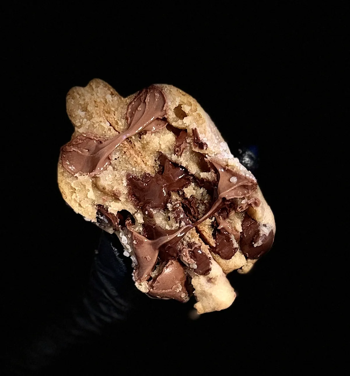 A PinCH cookie split open to show the chocolate inside